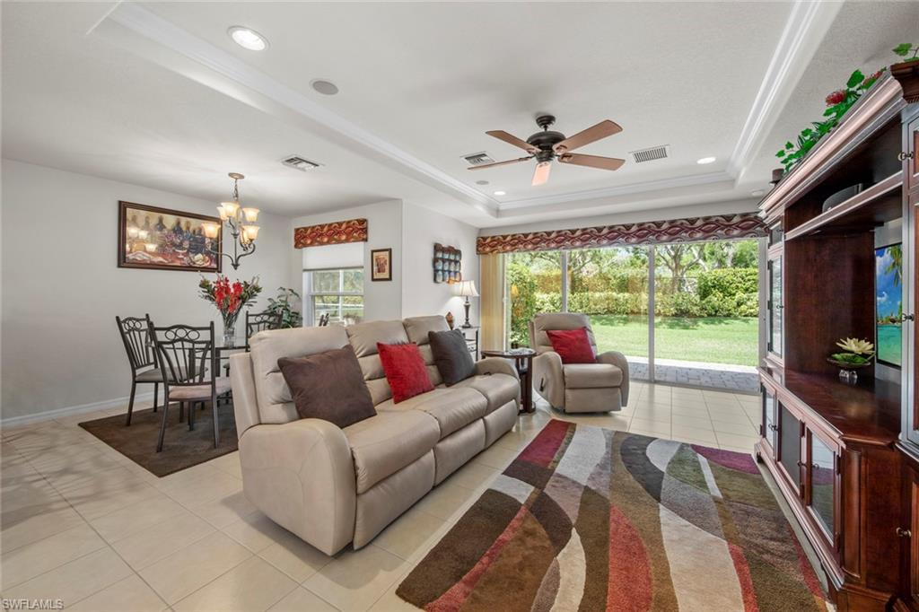 9046 Astonia Way Estero, FL 33967 - Photo 13 of 47 a living room with furniture and a flat screen tv