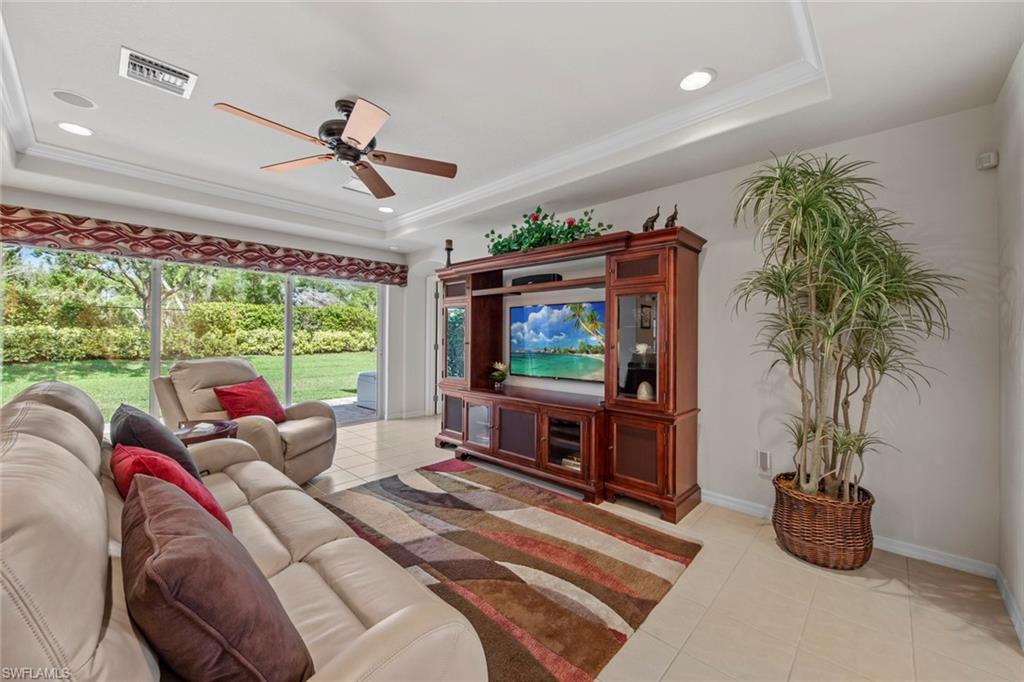 9046 Astonia Way Estero, FL 33967 - Photo 14 of 47 a living room with furniture a window and a flat screen tv