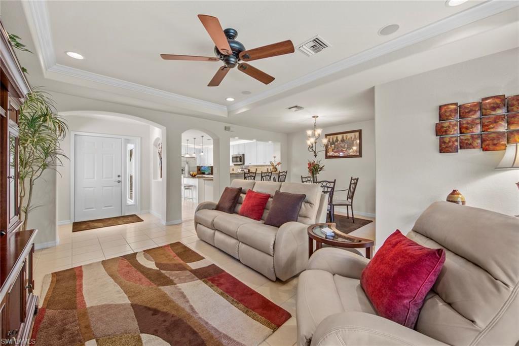 9046 Astonia Way Estero, FL 33967 - Photo 15 of 47 a living room with furniture and a wooden floor