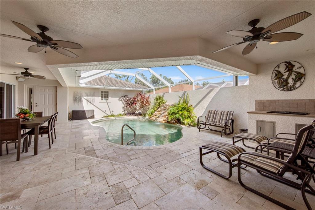 9046 Astonia Way Estero, FL 33967 - Photo 3 of 47 a view of a livingroom with furniture and a ceiling fan