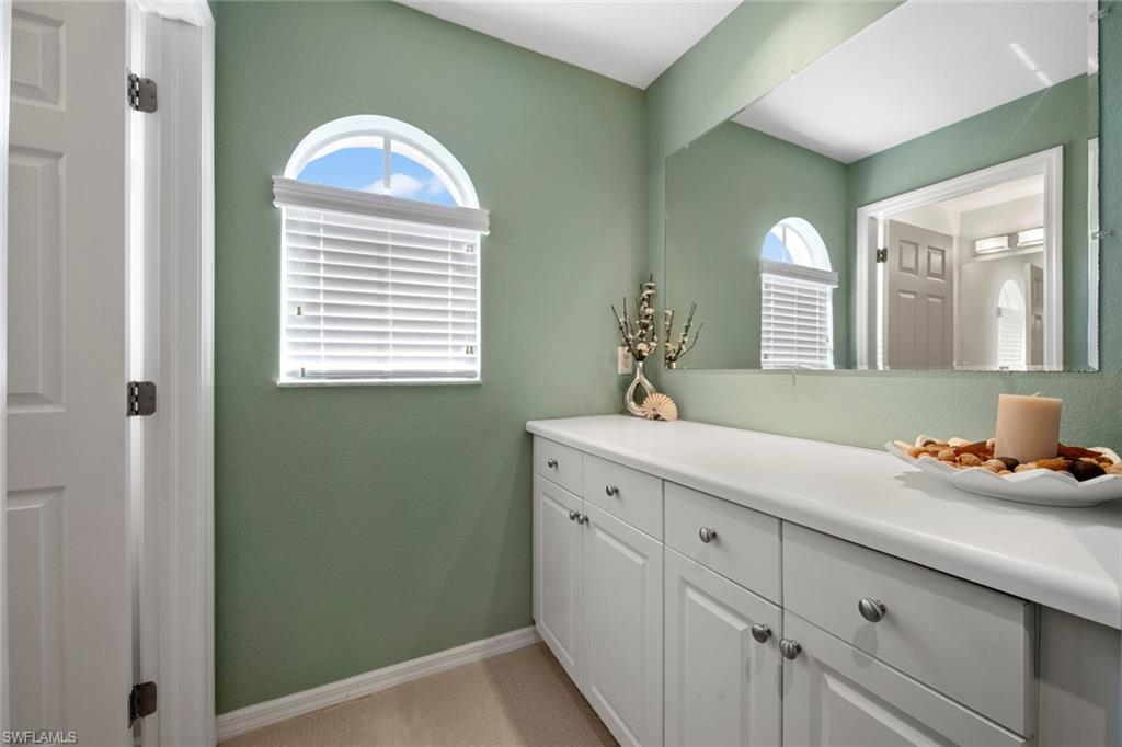 9046 Astonia Way Estero, FL 33967 - Photo 31 of 47 a kitchen with a sink and a window