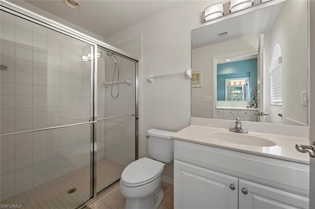 9046 Astonia Way Estero, FL 33967 - Photo 32 of 47 a bathroom with a sink toilet and shower