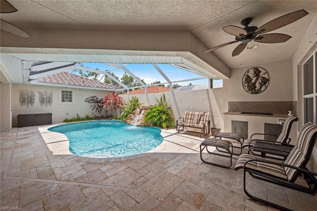 9046 Astonia Way Estero, FL 33967 - Photo 5 of 47 a view of a chairs and table in a patio