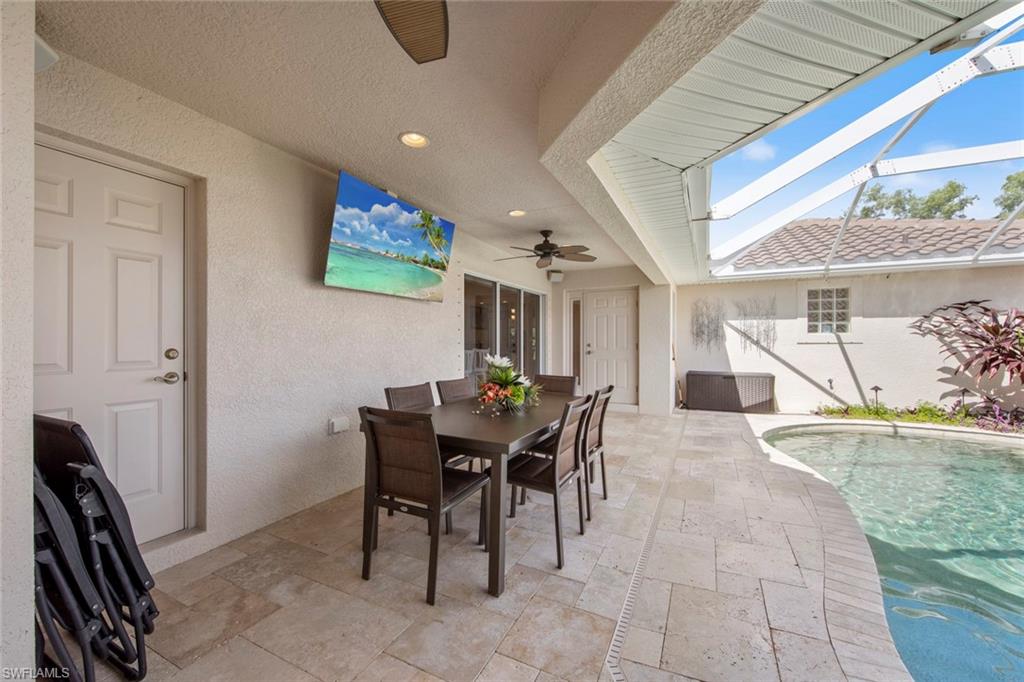 9046 Astonia Way Estero, FL 33967 - Photo 9 of 47 a view of a dining room with furniture and a potted plant