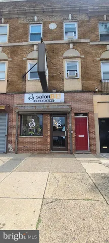 a view of hallway with wooden floor