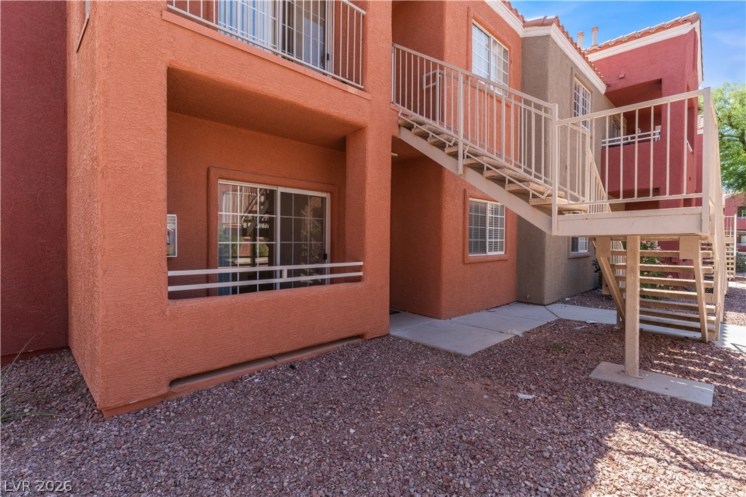 4730 East Craig Road, Unit 1058 Las Vegas, NV 89115 - Photo 1 of 30 Textured facade with private balconies and external stairs enhance this multi-level dwelling.