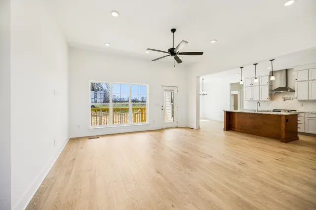 a view of a kitchen with a sink and a window