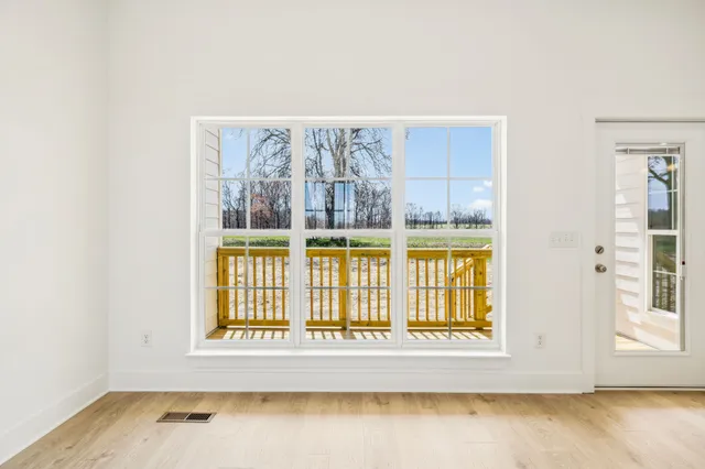 a view of wooden floor and brick walls