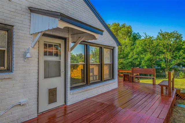 a view of a chairs and table in the balcony