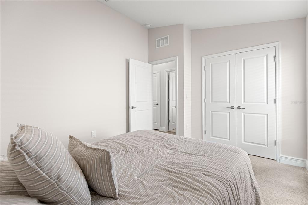 9611 Southwest 62nd Court Ocala, FL 34476 - Photo 13 of 41 a bedroom with a bed and a closet