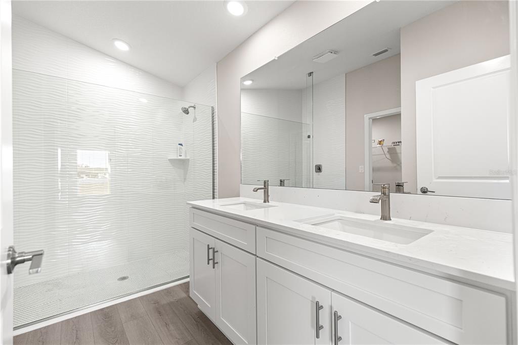 9611 Southwest 62nd Court Ocala, FL 34476 - Photo 14 of 41 a bathroom with a sink and a mirror