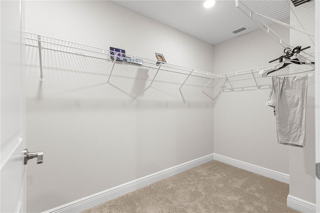 9611 Southwest 62nd Court Ocala, FL 34476 - Photo 15 of 41 a view of a room with racks on the wall