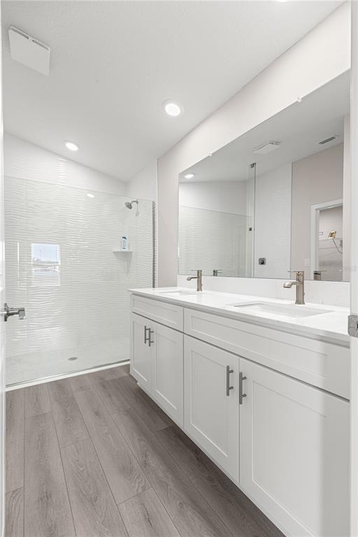 9611 Southwest 62nd Court Ocala, FL 34476 - Photo 21 of 41 a bathroom with double vanity sinks and a mirror