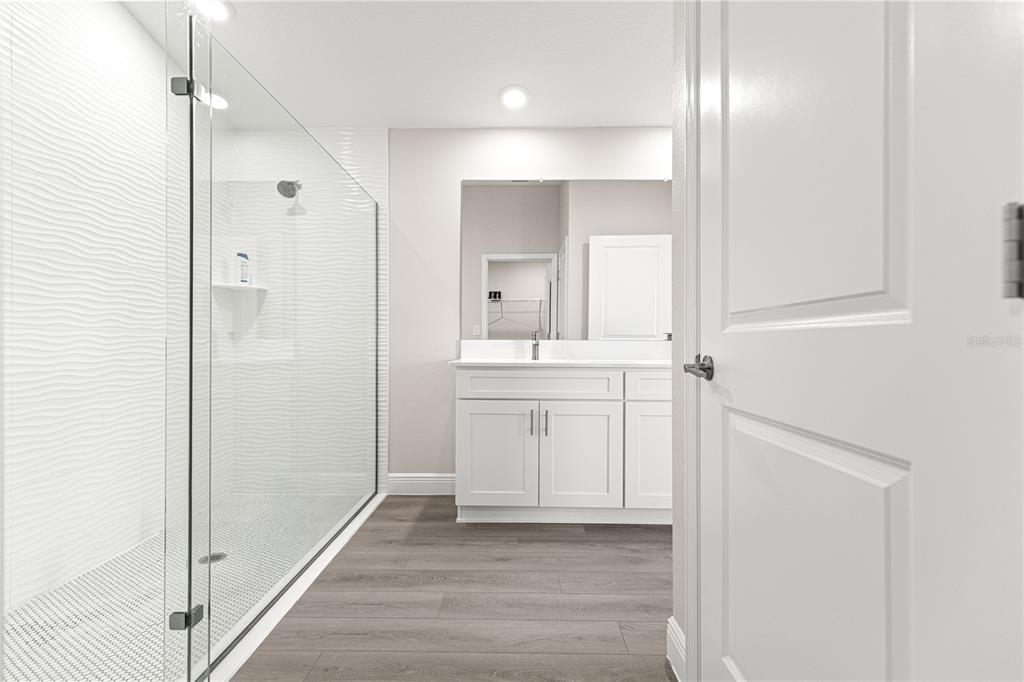 9611 Southwest 62nd Court Ocala, FL 34476 - Photo 23 of 41 a bathroom with a sink and a mirror