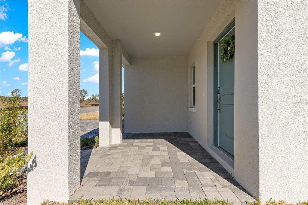 9611 Southwest 62nd Court Ocala, FL 34476 - Photo 28 of 41 a view of a hallway with wooden floor and a living room