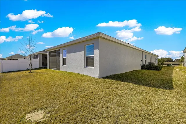 a view of a backyard of the house