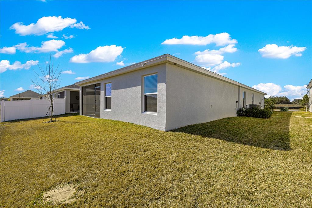 9611 Southwest 62nd Court Ocala, FL 34476 - Photo 29 of 41 a view of a house with backyard and garden