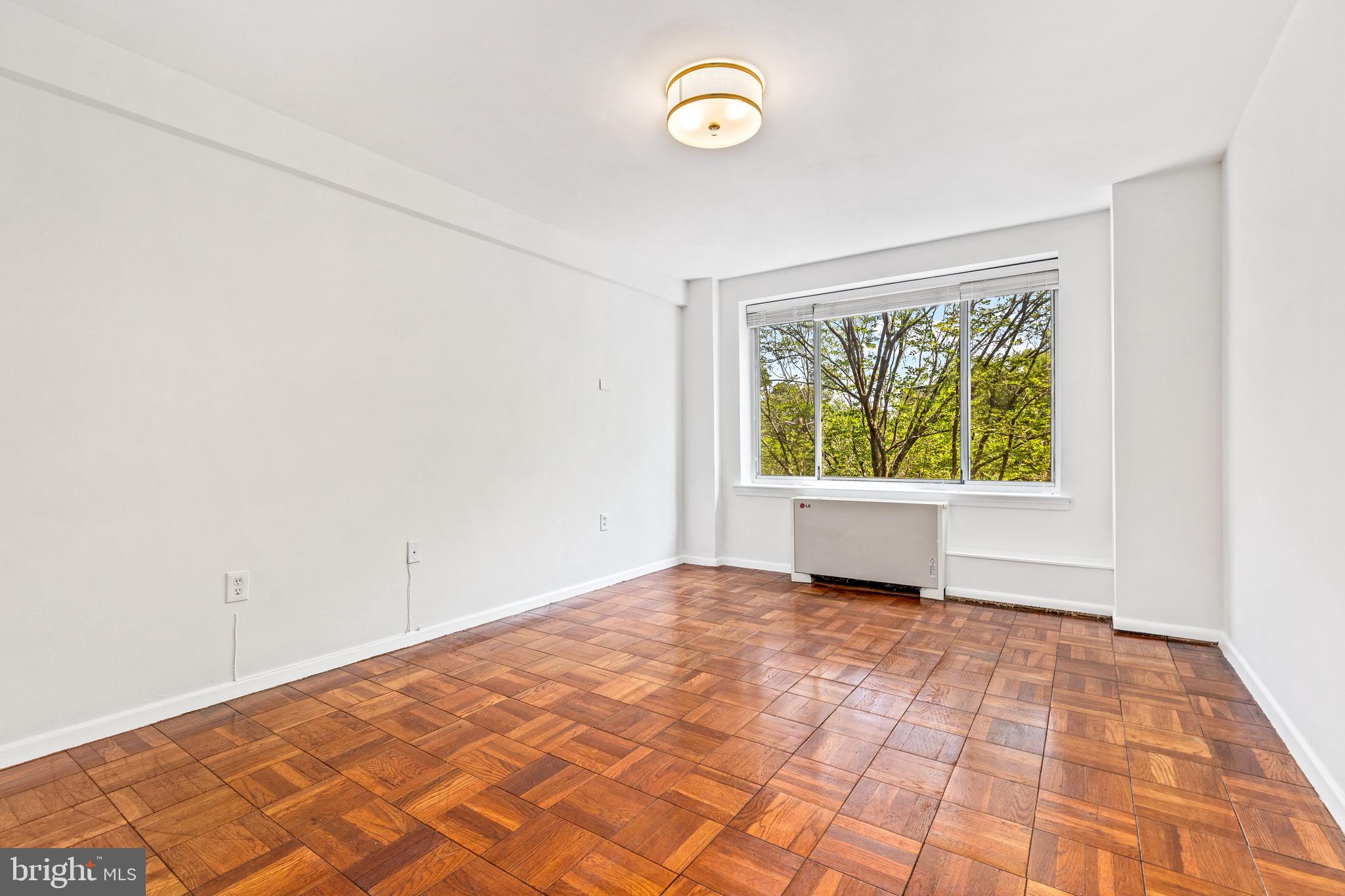4100 W Street Northwest, Unit 306 Washington, DC 20007 - Photo 11 of 23 an empty room with window