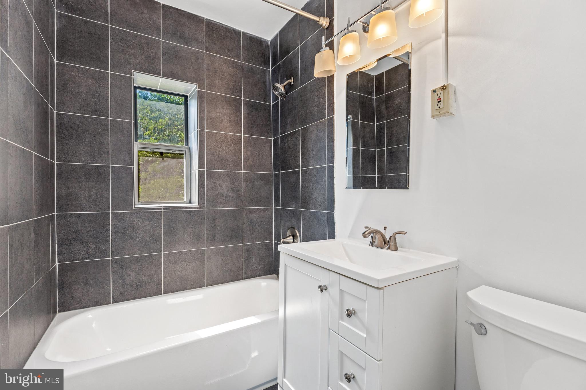 4100 W Street Northwest, Unit 306 Washington, DC 20007 - Photo 15 of 23 a bathroom with a sink toilet and shower