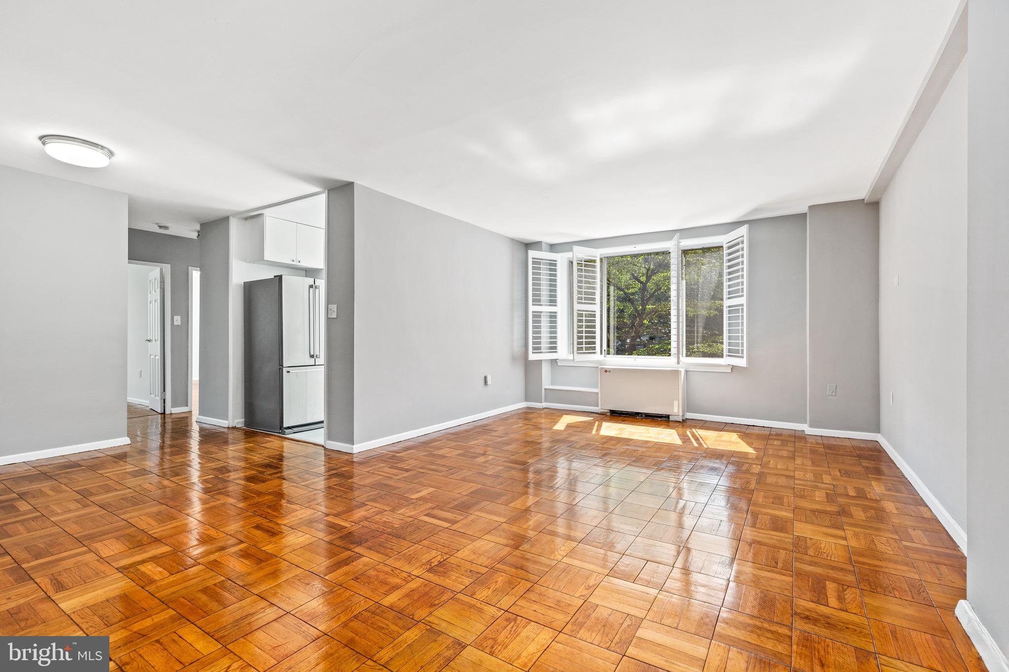 4100 W Street Northwest, Unit 306 Washington, DC 20007 - Photo 2 of 23 a view of an empty room with a window