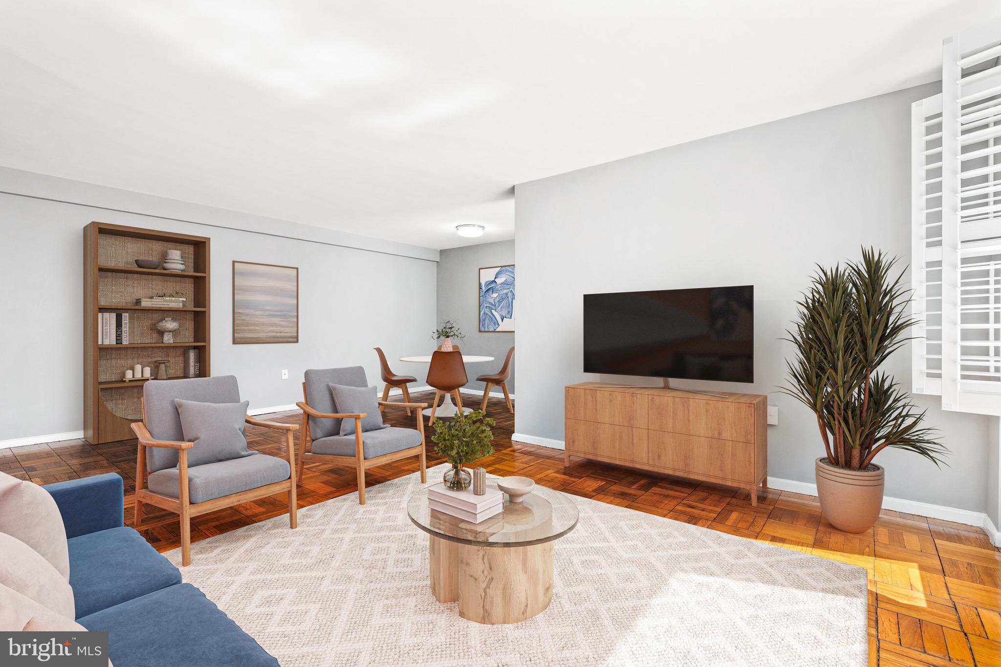 4100 W Street Northwest, Unit 306 Washington, DC 20007 - Photo 3 of 23 a living room with furniture and a flat screen tv
