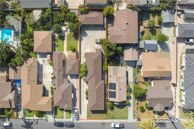 an aerial view of residential houses with outdoor space
