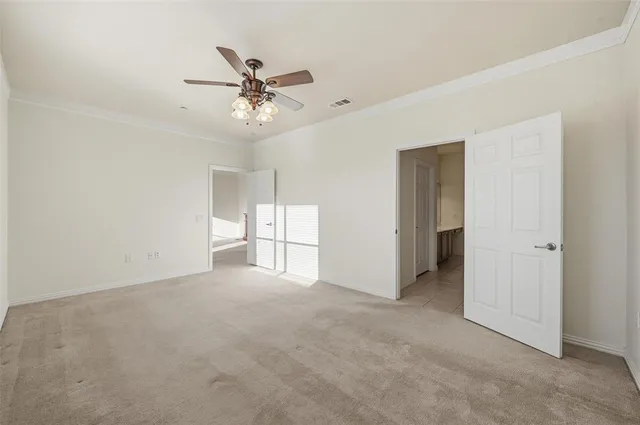 a view of a livingroom with a ceiling fan and window