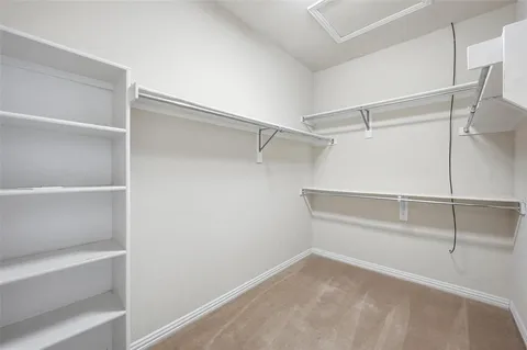 a view of an empty walk in closet