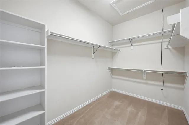 a view of an empty walk in closet