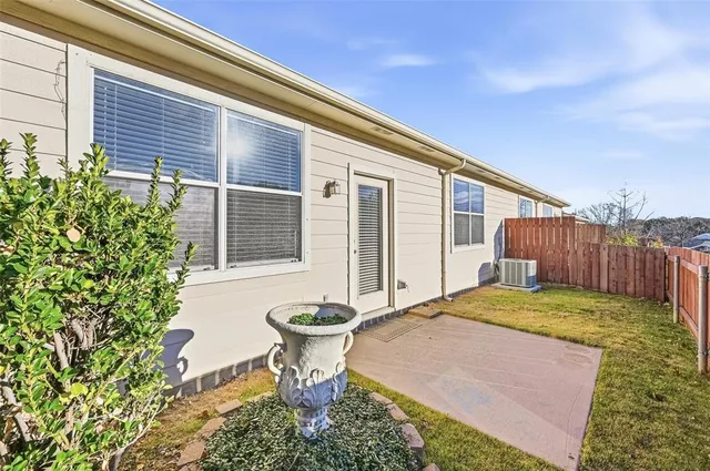 a backyard of a house with yard and outdoor seating