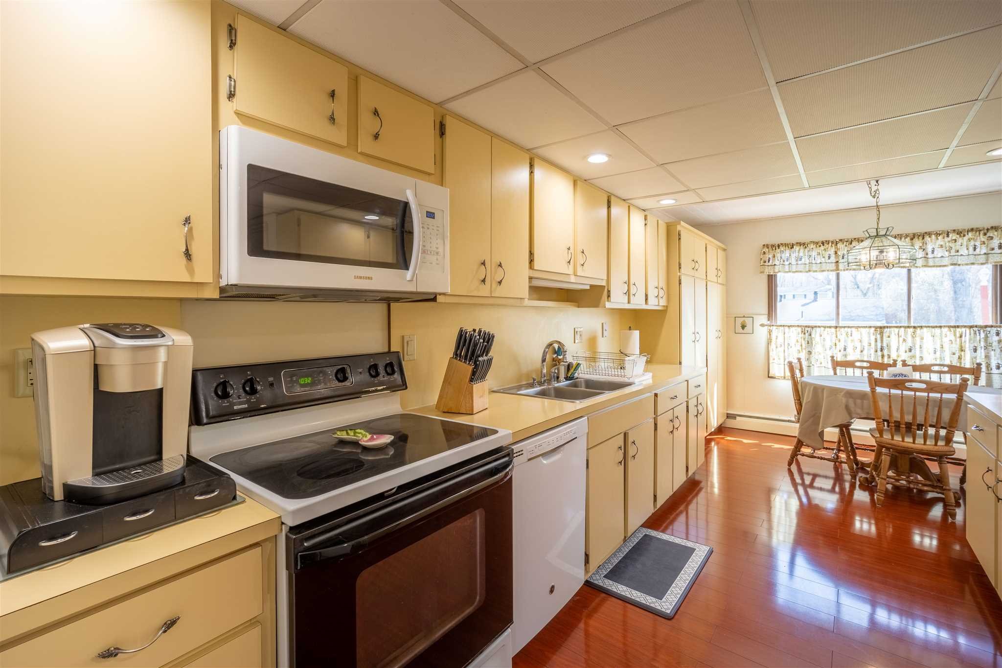 137 Bart Drive La Grange, NY 12603 - Photo 12 of 30 a kitchen with a stove and a microwave