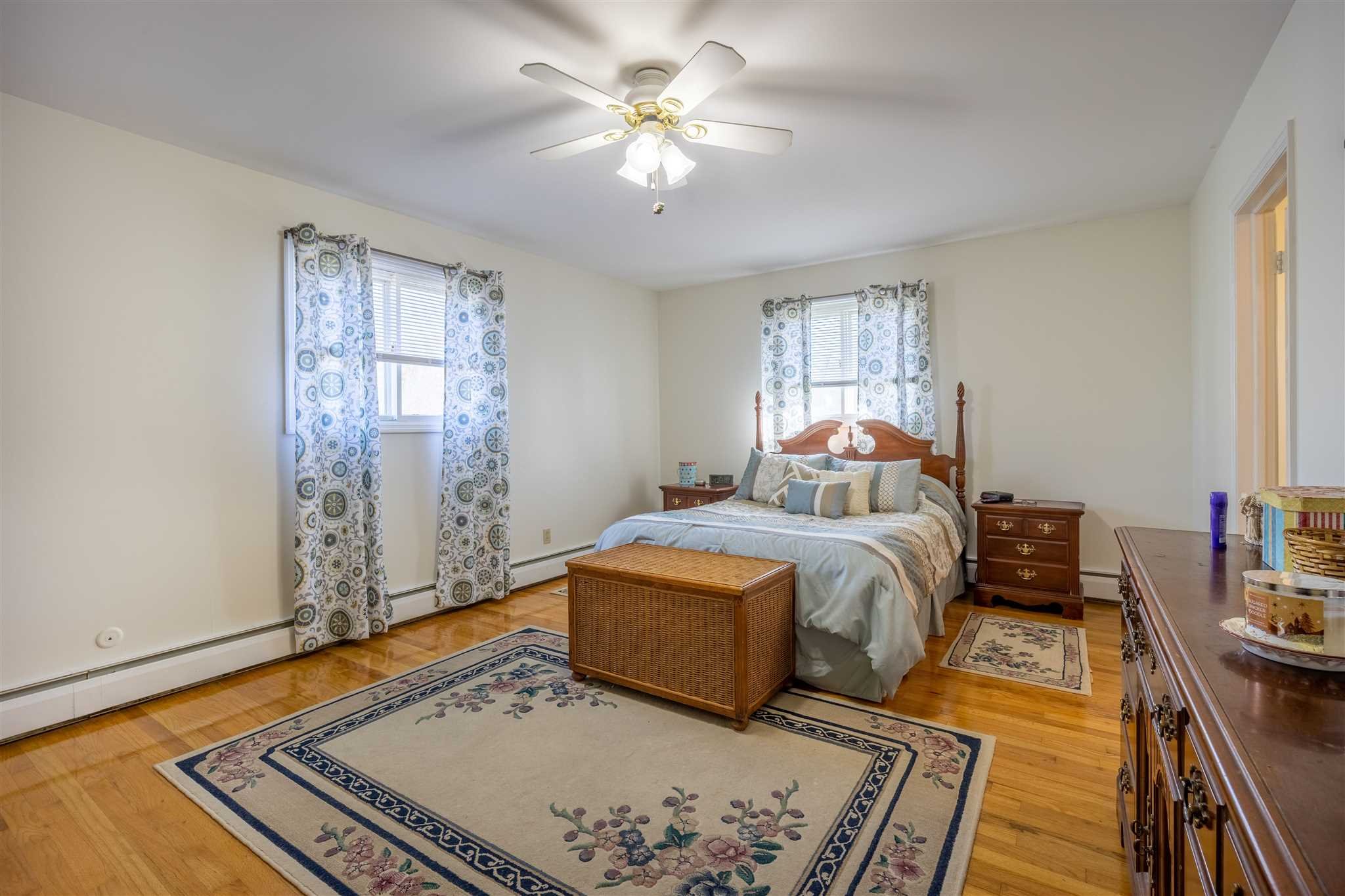 137 Bart Drive La Grange, NY 12603 - Photo 17 of 30 a bedroom with a bed and wooden floor