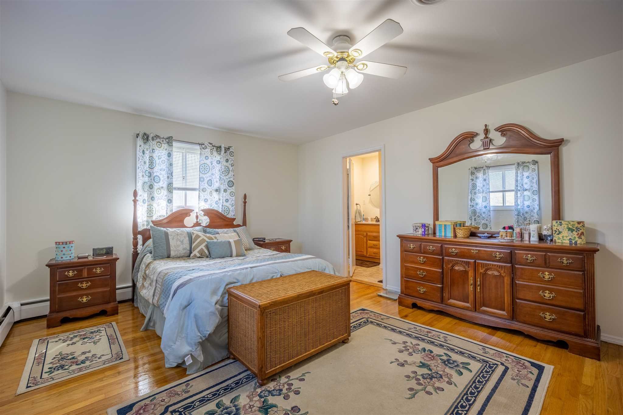 137 Bart Drive La Grange, NY 12603 - Photo 18 of 30 a bedroom with a bed and a mirror on dresser
