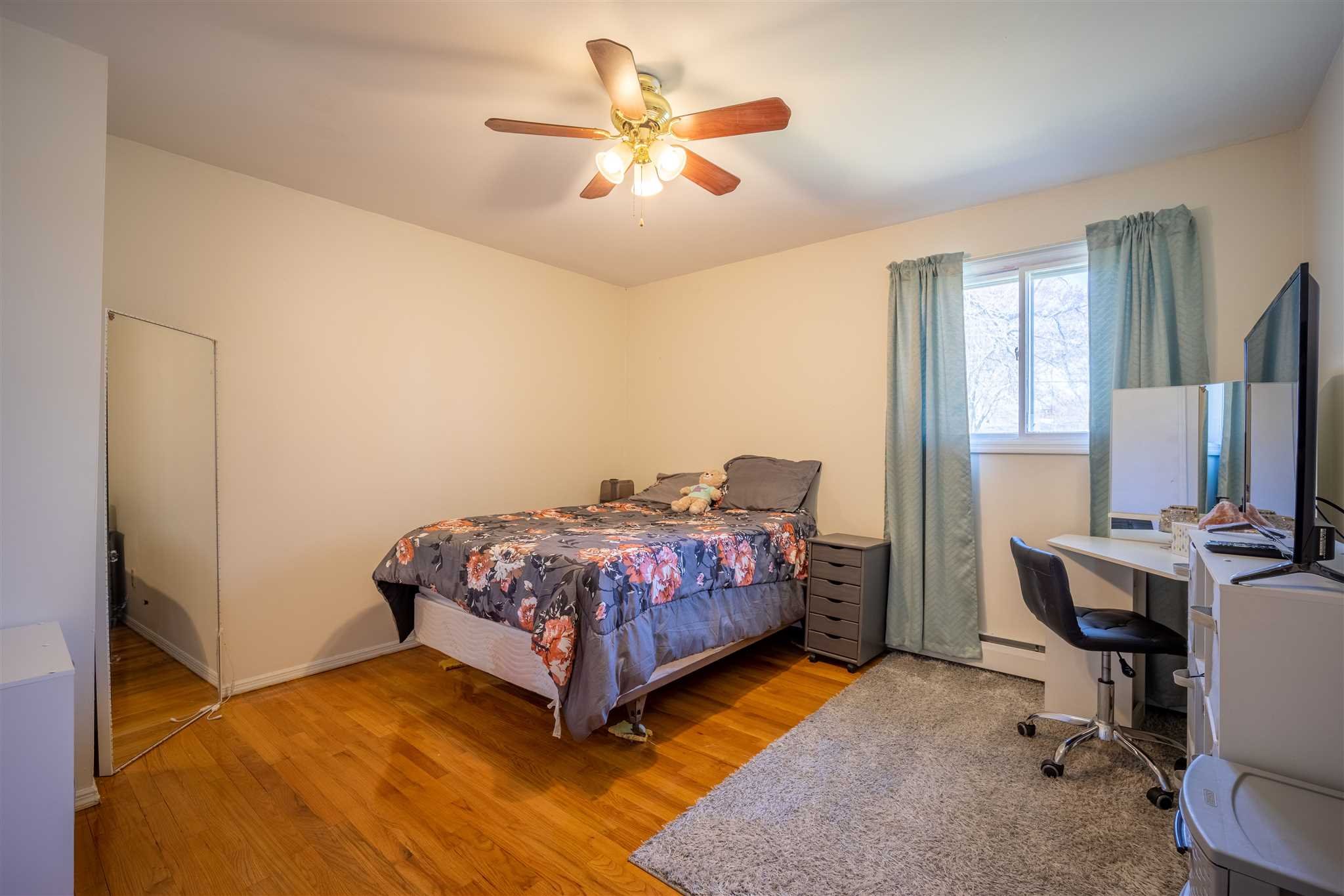 137 Bart Drive La Grange, NY 12603 - Photo 21 of 30 a bedroom with a bed a desk and chair