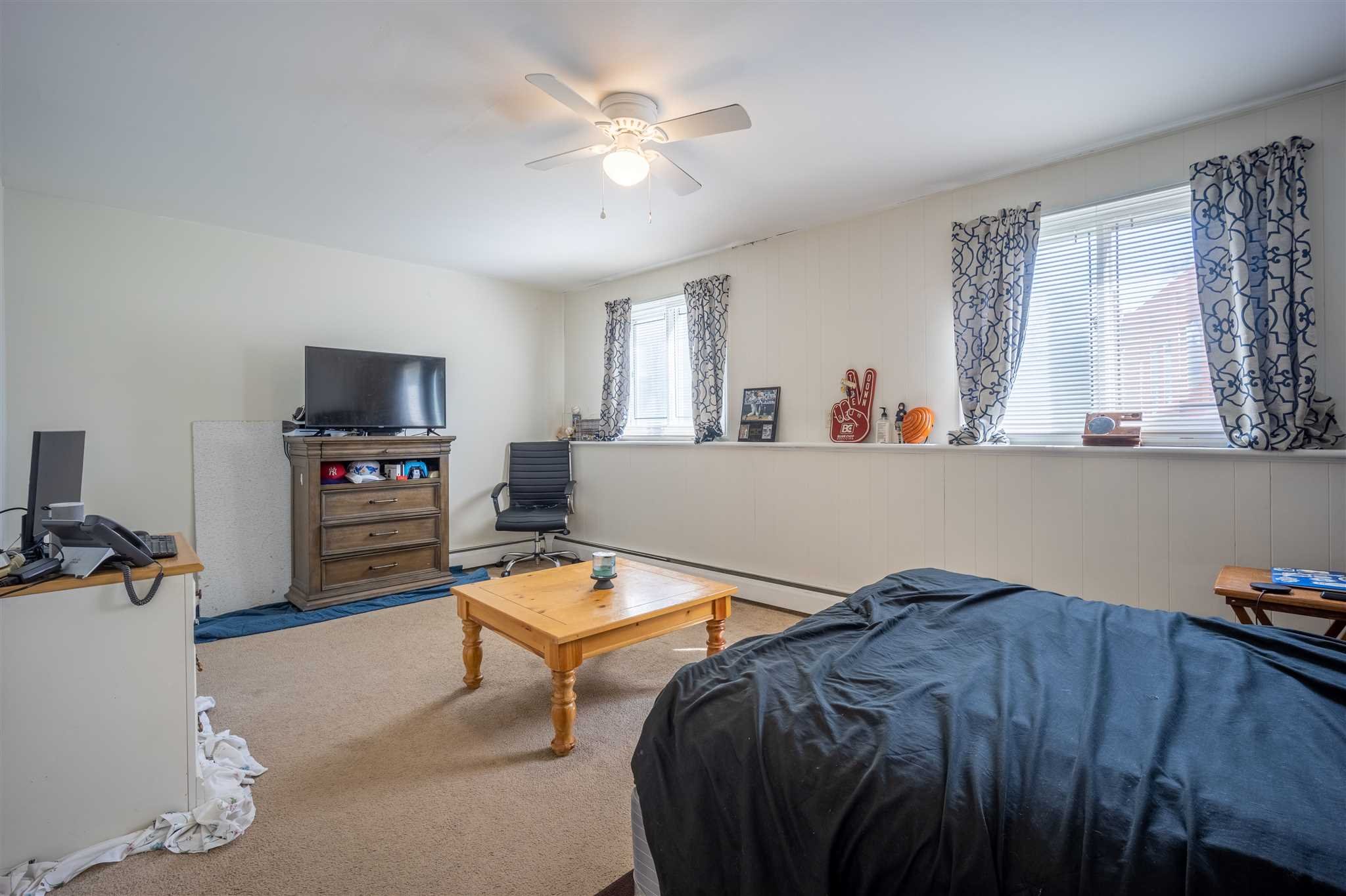 137 Bart Drive La Grange, NY 12603 - Photo 25 of 30 a living room with furniture and a flat screen tv