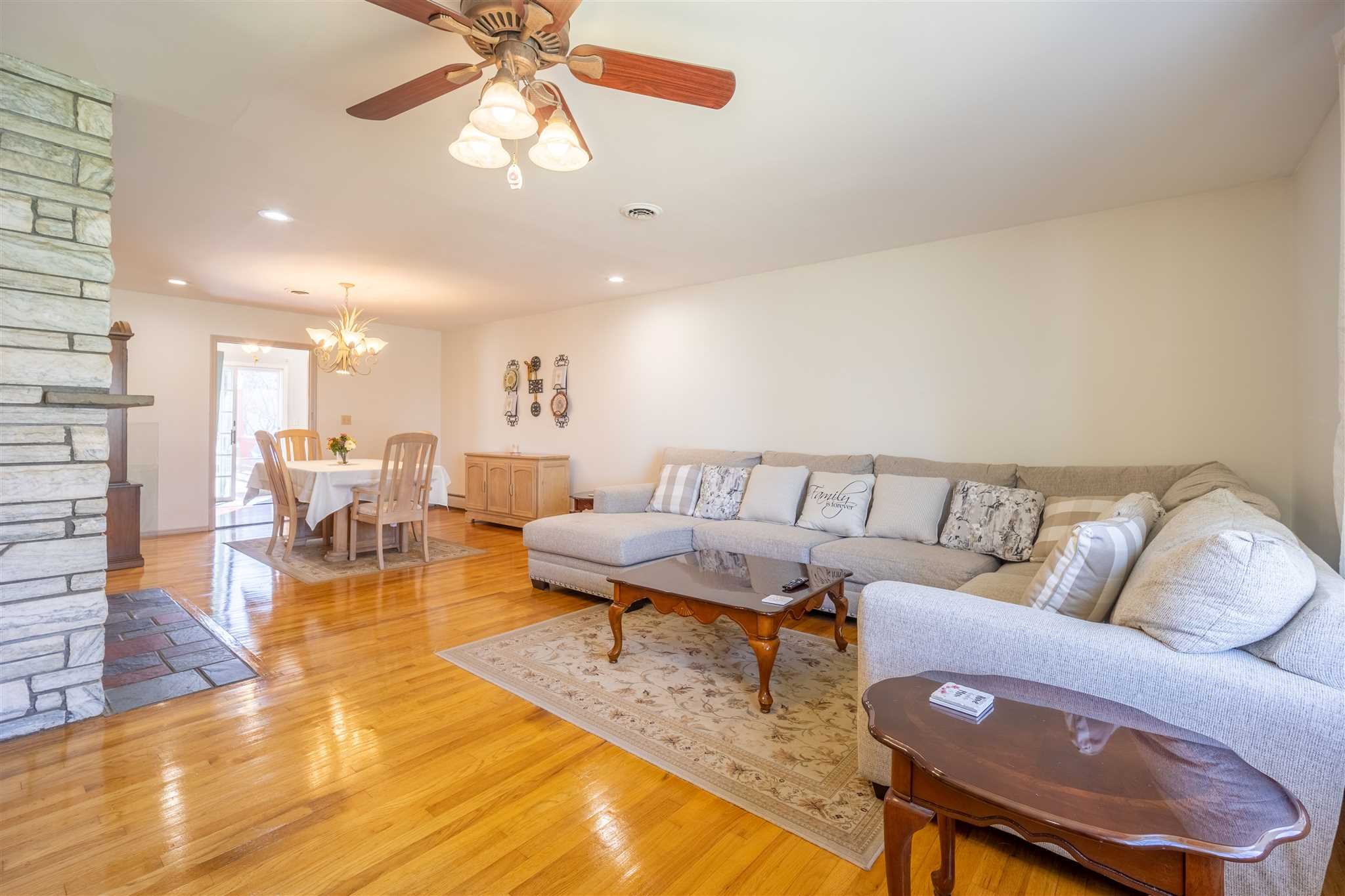 137 Bart Drive La Grange, NY 12603 - Photo 5 of 30 a living room with furniture and a chandelier