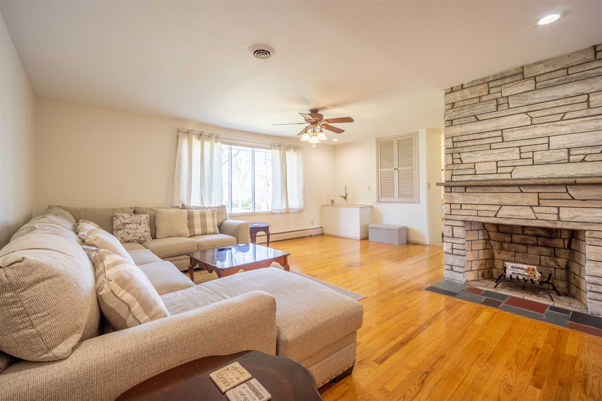 137 Bart Drive La Grange, NY 12603 - Photo 6 of 30 a living room with furniture and a fireplace