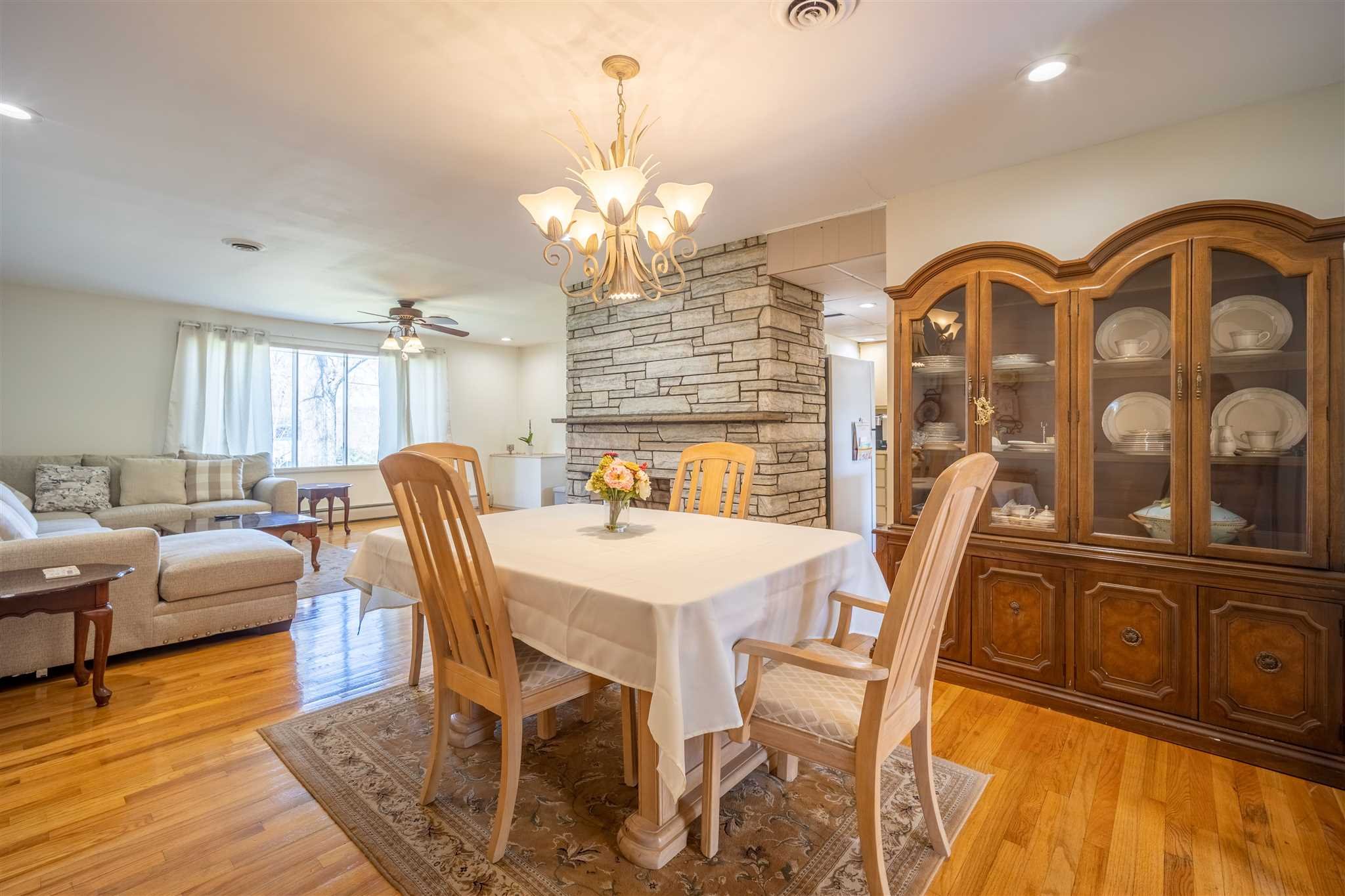 137 Bart Drive La Grange, NY 12603 - Photo 7 of 30 a view of a dining room with furniture a chandelier and wooden floor