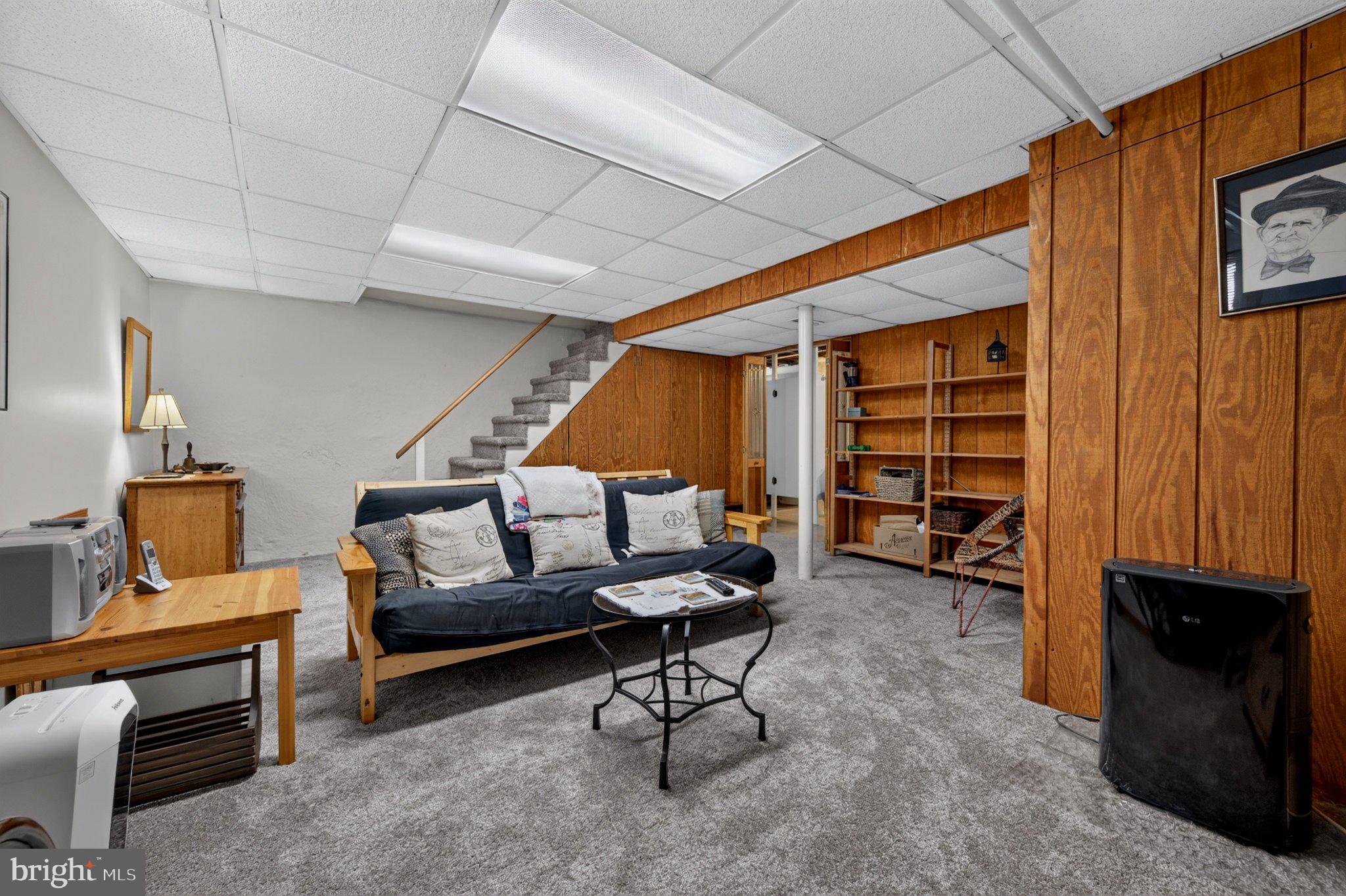 128 Boncouer Road Cheltenham, PA 19012 - Photo 23 of 31 Cozy basement retreat with warm wood accents.