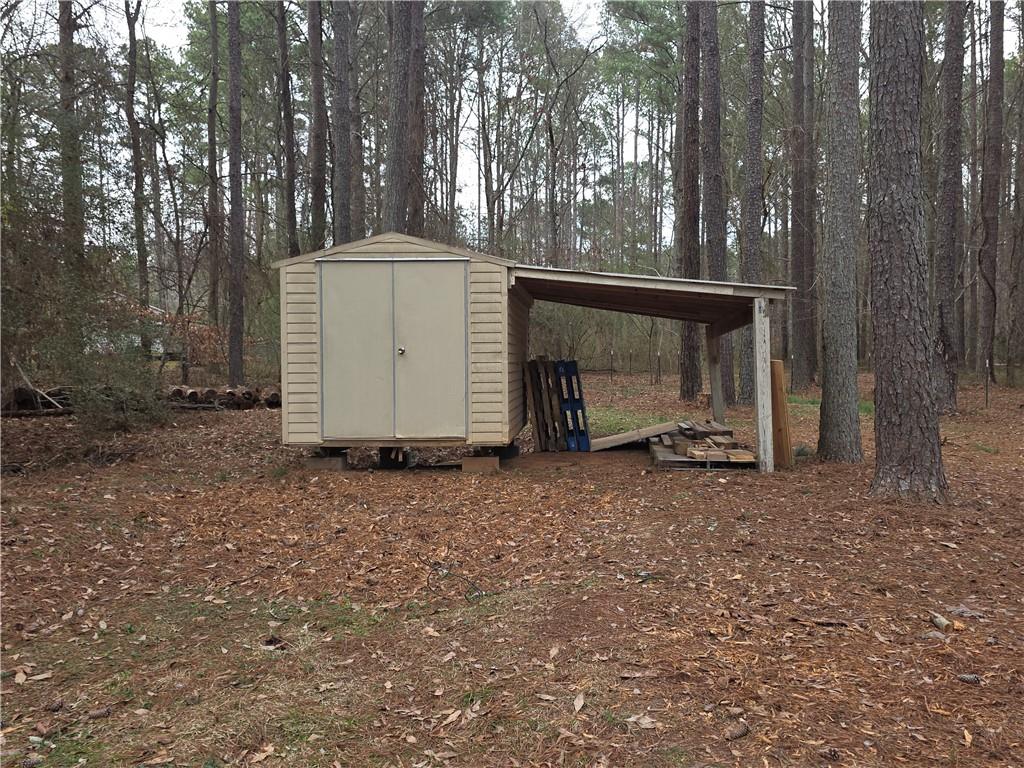 1180 North Ola Road McDonough, GA 30252 - Photo 42 of 47 a view of backyard and tree