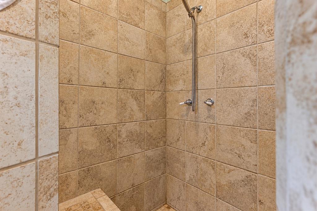 2400 Springfield Road Springtown, TX 76082 - Photo 17 of 31 Large, tiled shower with bench