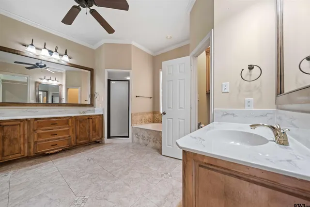 a spacious bathroom with a double vanity sink mirror and double