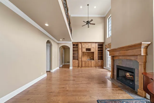 a view of an empty room with a fireplace
