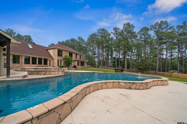 a view of a house with a swimming pool
