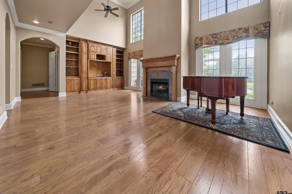 a view of a livingroom with a fireplace and window