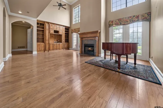 a view of a livingroom with a fireplace and window