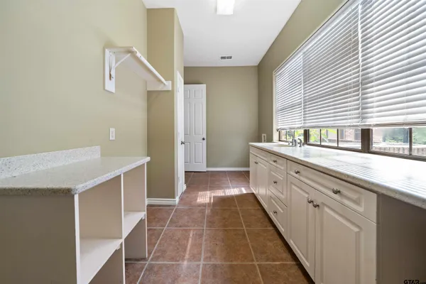 a bathroom with a double vanity sink and a bathtub