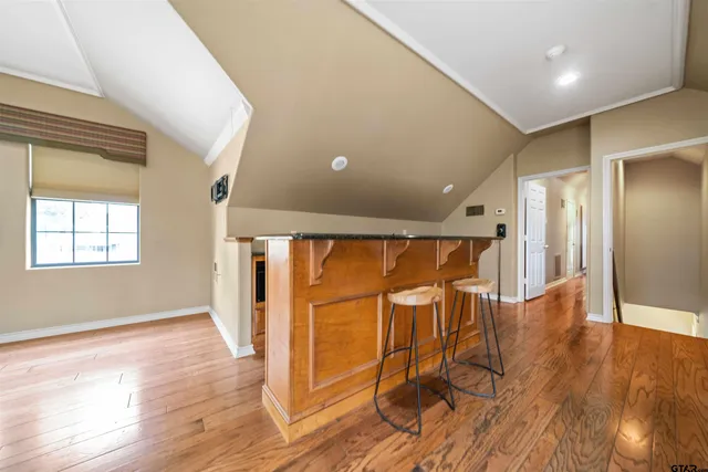 a view of a livingroom with furniture wooden floor and window