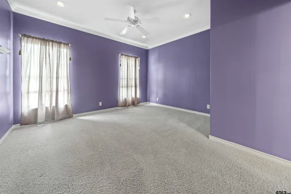 a view of an empty room with windows
