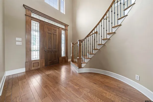a view of an entryway with wooden floor